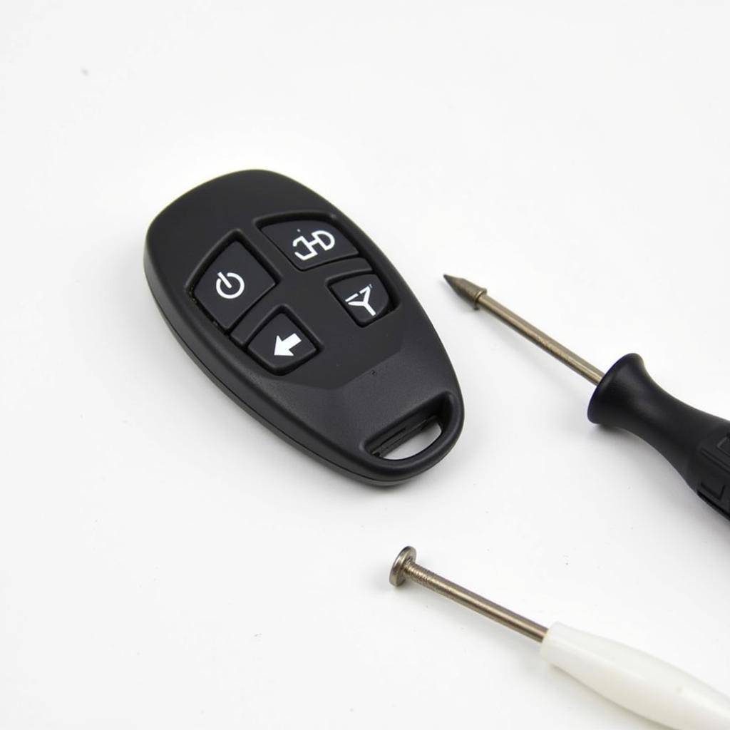 CR2032 Battery and Tools for Key Fob Replacement